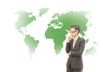 Youth business thinking about green world idea for future concept, Young asian business man holding pencil and thinking with green world map on thebackground