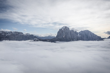Dolomites, Italy - Beautiful landscape scenery above clouds on sunny autumn day