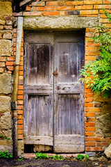 Old, vintage, antique door in Montalcino, Italy