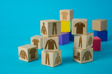 children's toy wooden cubes with patterns of clothes for work