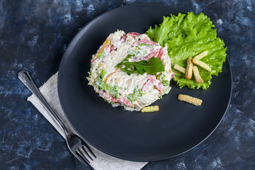 Salad of crackers, Peking cabbage, sweet pepper, hard cheese, balyk. Dressed with mayonnaise sauce. Garnished with cranberries. Festive, New Year's dish. High-calorie, nutritious. Copy space. 