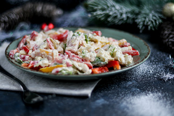 Salad of crackers, Peking cabbage, sweet pepper, hard cheese, balyk. Dressed with mayonnaise sauce. Garnished with cranberries. Festive, New Year's dish. High-calorie, nutritious. Copy space. 