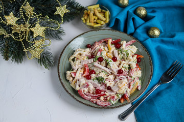 Salad of crackers, Peking cabbage, sweet pepper, hard cheese, balyk. Dressed with mayonnaise sauce. Garnished with cranberries. Festive, New Year's dish. High-calorie, nutritious. Copy space. 
