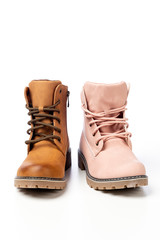 different leather shoes with laces in pink and brown on a white background