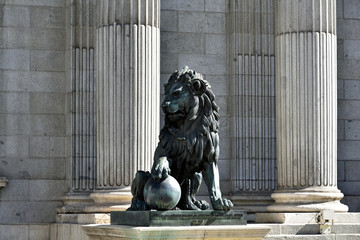 MADRID / SPAIN - APRIL 11, 2019 - Lion sculpture in front of Building of Congress of Deputies...