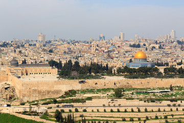 Jerusalem Old city cityscape panorama with Dome of the Rock with gold leaf and Al-Aqsa Mosque on Temple Mount and Rotunda of Church of the Holy Sepulchre, Israel