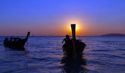 Long tail boat summer golden sunset