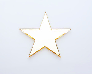 Festive five-pointed shiny star on white background