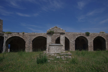 Fototapeta na wymiar Ruins of the Abbazia Santa Maria a Mare cloister, Island of San Nicola, Tremiti Islands, Adriatic Sea, Puglia, Italy