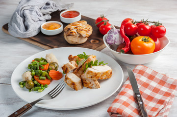Fried chicken fillet and boiled vegetables