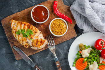 Fried chicken fillet and boiled vegetables