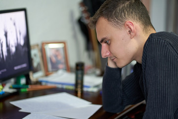 Fototapeta na wymiar Young student doing homework