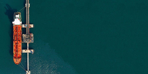 Aerial drone panoramic photo of industrial oil and fuel tanker cruising deep blue open ocean sea