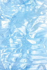 Obraz premium Blue crumpled bottle texture. Garbage backdrop- concept of plastic- recycle, saving the environment and pollution of the world ocean
