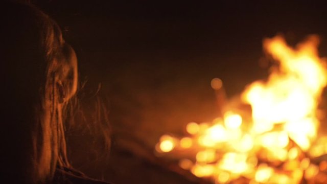 Silhouette of mystic woman in black background of fire fly flame, spark, of contour outline. Adult sexy of young girl witchcraft ceremony ritual dance in underclothes. Outdoor slow motion. Caucasian.