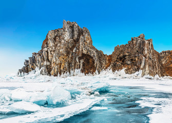Fototapeta na wymiar View of Shamanka rock on a sunny winter day. Lake Baikal, Olkhon island. Eastern Siberia, Russia