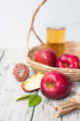 tea and apples on wood background