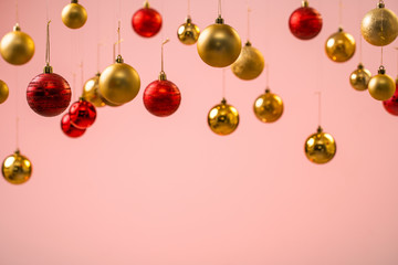 Christmas balls on pink background