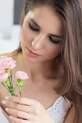 Young well-groomed girl with long brown hair and clean skin.