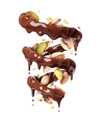 Chocolate splashes in spiral shape with crushed pistachios, isolated on a white background