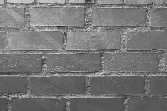 Beautiful black and ahite old street art brick wall backgroun dwith copyspace. Abstract creative spray drawing on the walls of the city. Urban Culture, black ,white, gray texture