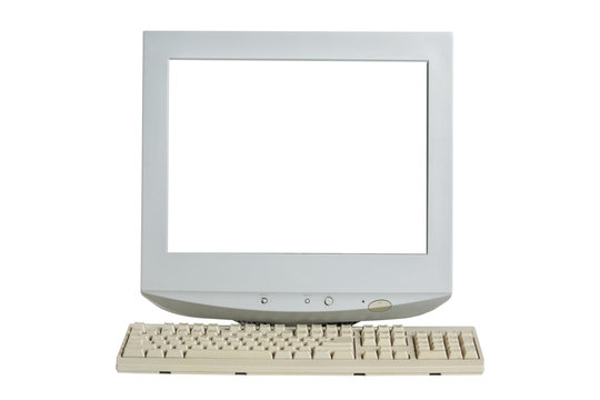 Old retro CRT monitor display with blank white screen and a keyboard isolated on white background.
