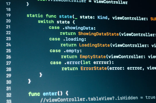 Program code in close up. Mobile app development. Programming language. IT Software Development Outsourcing Concept. IT outstaffing for software development.