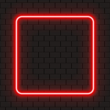 Bright Square Red Neon Frame For Banner Or Sign Isolated On A Dark Brick Wall.