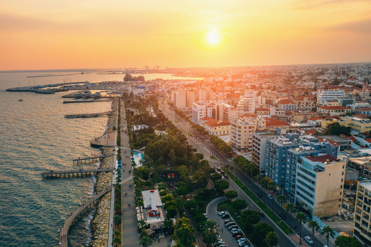 Limassol, Cyprus aerial view at sunset. Promenade with alley and buildings. Drone photo of mediterranean sea resort from above.