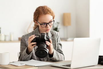 Reporter off loading files from camera to laptop