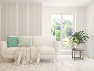 Stylish room in white color with sofa and summer landscape in window. Scandinavian interior design. 3D illustration