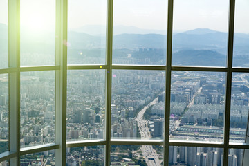 View at Seoul, South Korea from high floor at viewpoint at sunny day through huge windows