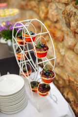 cup cakes on a little ferris wheel at a wedding
