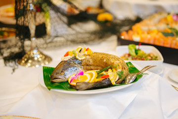 trout at a buffet table