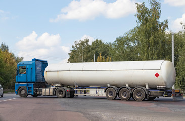 A gas tanker on a city highway