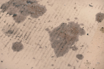 Oil stains on cardboard. Cheap oil leak absorbing.