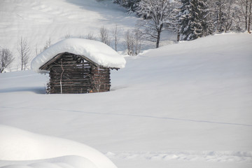 winter impressions with snow and huts