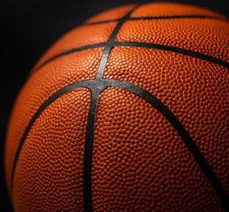 Basketball under the light with a black background
