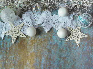 White and silver Christmas decoration on blue Grunge background