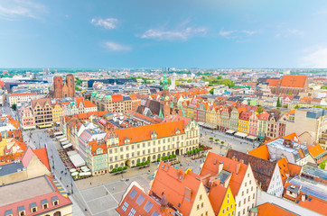 Naklejka na ściany i meble Top aerial panoramic view of Wroclaw old town historical city centre with Rynek Market Square, Old Town Hall, New City Hall, colorful buildings with multicolored facade and tiled roofs, Poland