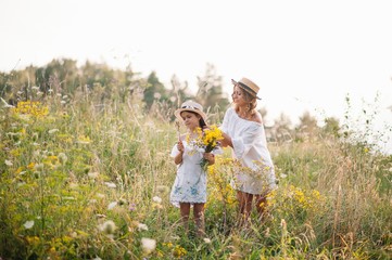 Young mother and her daughter have fun, mother's Day.