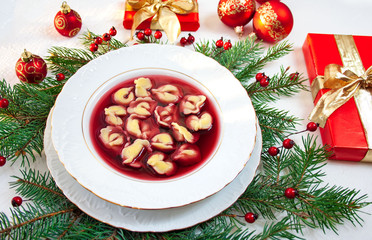 Fototapeta na wymiar Polish christmas soup - beetroot soup with dumplings