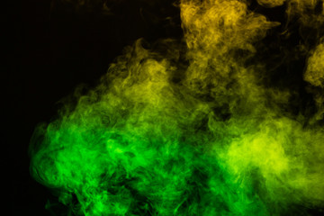 green and yellow smoke overlay on a black background