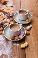 A traditional Dutch holiday for children of Sinterklaas. Winter holidays in Europe and the Netherlands. Background with pepernoten and traditional sweets. A form for writing text and aromatic coffee.