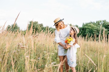 Young mother and her daughter have fun, mother's Day.