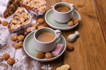 A traditional Dutch holiday for children of Sinterklaas. Winter holidays in Europe and the Netherlands. Background with pepernoten and traditional sweets. A form for writing text and aromatic coffee.