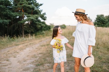 Young mother and her daughter have fun, mother's Day.