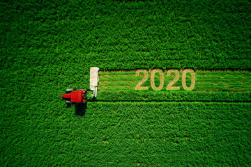 Tractor mowing green field