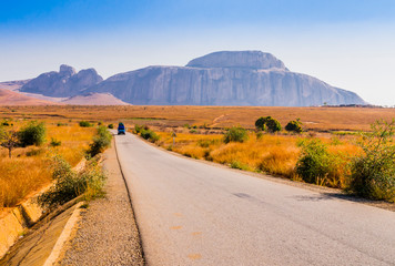 Madagascar, scenic view of Route Nationale 7 (RN7), with Cardinal's hat in background, huge granite mountain forming part of Andringitra massif - 306778071