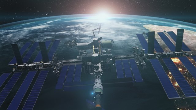 Close up of ISS orbiting realistic planet Earth. International Space Station revolving over ocean and mainland. Exploration mission. 3d render animation. Elements of this media furnished by NASA